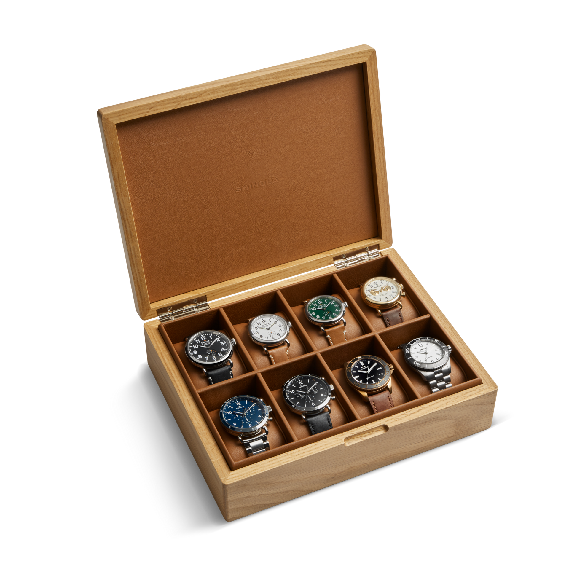 The Shinola 8 Slot Watch Box - Oak / Tan features a hinged lid and brown-lined compartments, elegantly storing up to eight wristwatches while highlighting each design and color.
