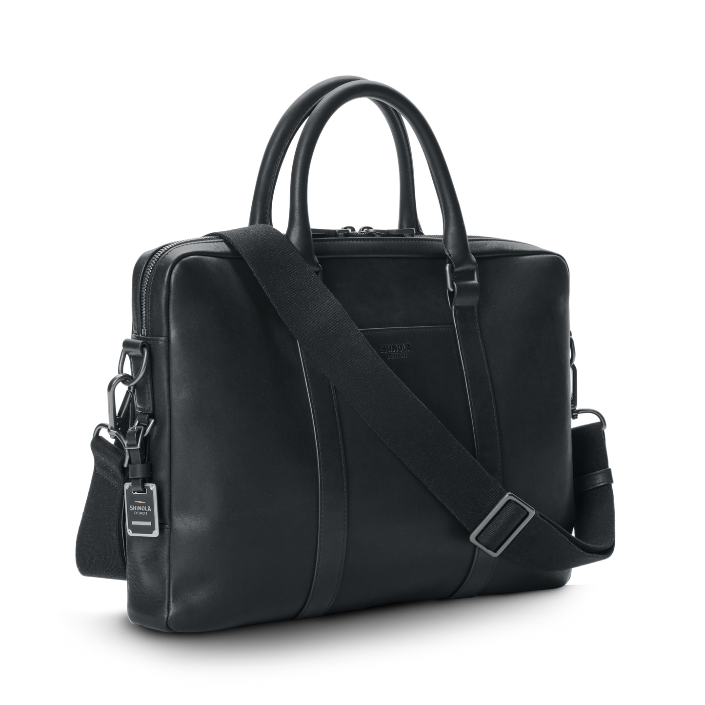 The shinola-jp.computer Briefcase - Black features double handles, a detachable shoulder strap, silver hardware, and a small branded tag, all in sleek black leather, shown against a plain white background.