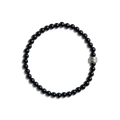 The Shinola 4mm Beaded Onyx Bracelet features small, round black onyx beads with a larger sterling silver accent bead engraved with text, shown on a white background.