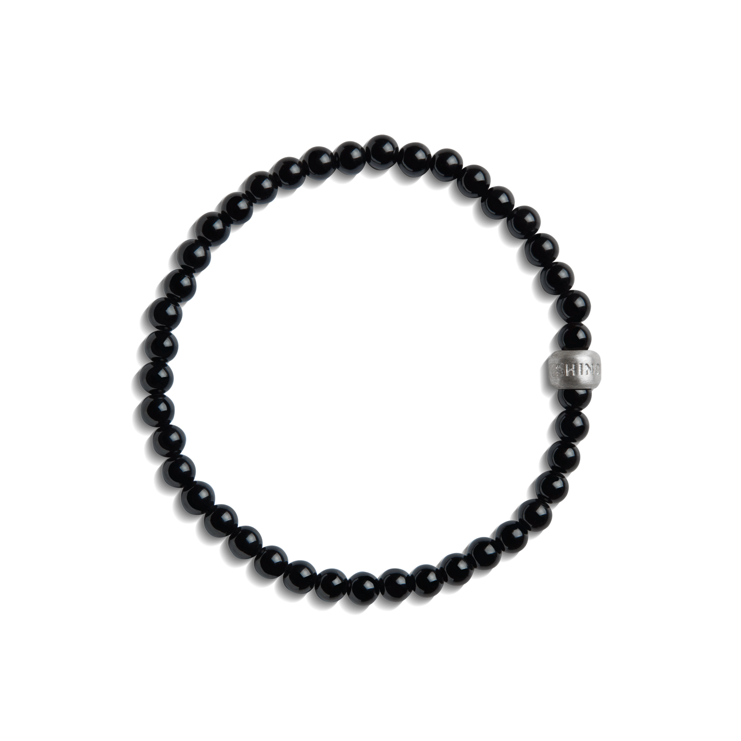 The Shinola 4mm Beaded Onyx Bracelet features small, round black onyx beads with a larger sterling silver accent bead engraved with text, shown on a white background.