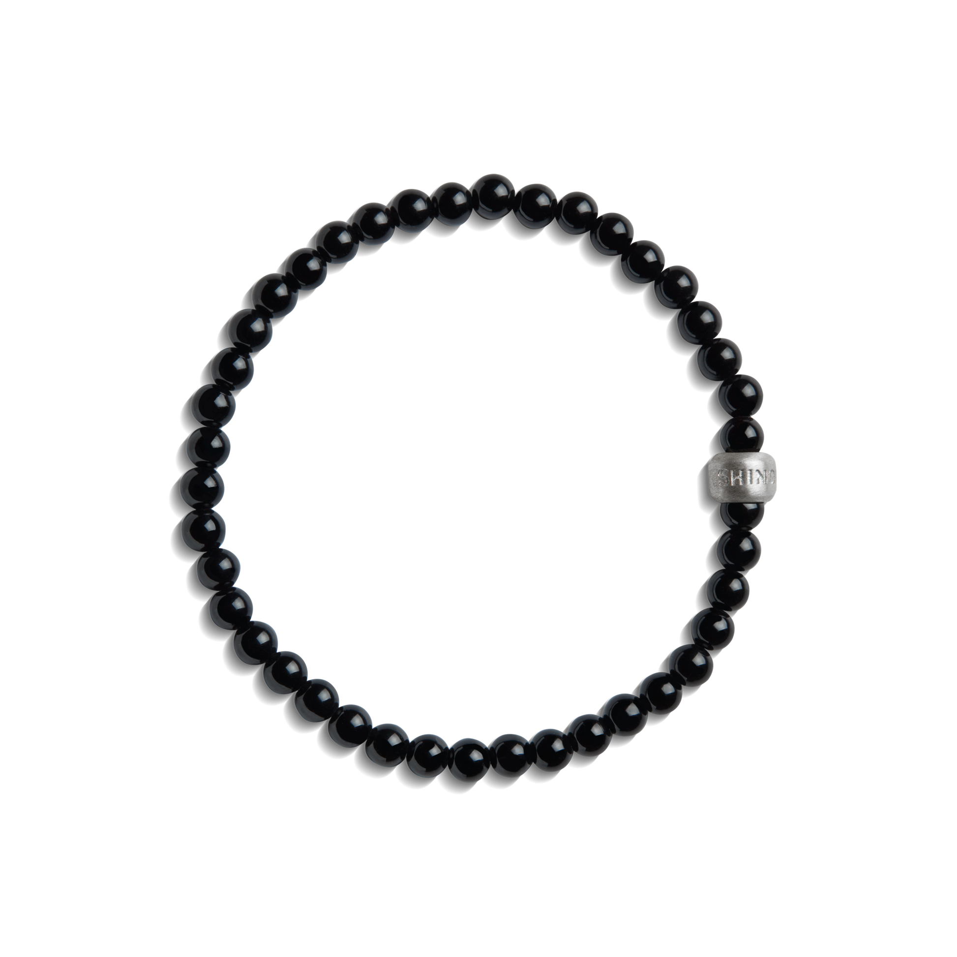 The Shinola 4mm Beaded Onyx Bracelet features small, round black onyx beads with a larger sterling silver accent bead engraved with text, shown on a white background.