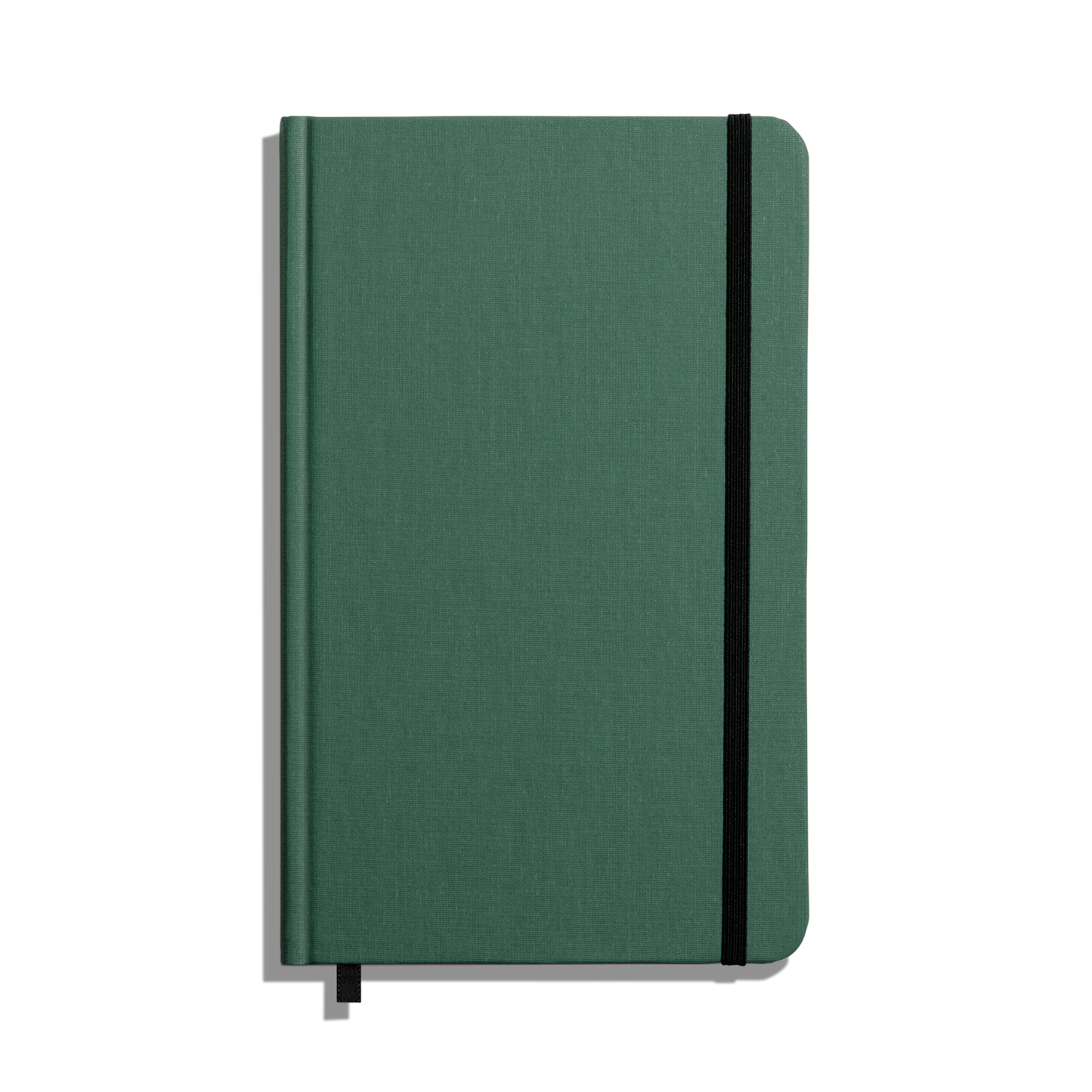 The Shinola Medium Hard Ruled Journal - Fern is a green linen, smyth-sewn notebook with a black elastic band and ribbon bookmark, shown from above on a white background.