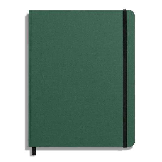The Shinola Large Hard Ruled Journal - Fern features a closed green hardcover, styled like a linen journal, with a black elastic band on the top right corner, a black ribbon bookmark at the bottom, and an unmarked plain cover.
