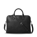 The Shinola Portfolio Briefcase - Black features a slim black leather design with two handles, a detachable shoulder strap, silver hardware, and zip closure, shown against a plain white background.