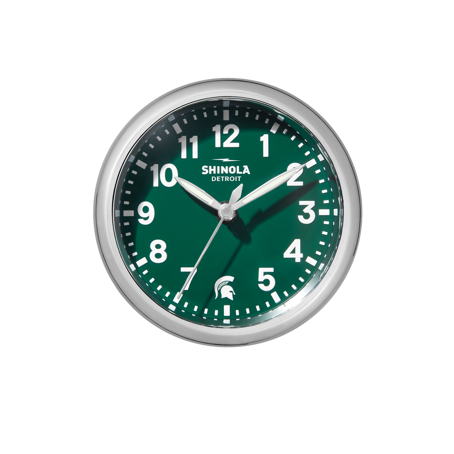 The Shinola 6" Runwell Clock - Green features a round Spartan green dial, silver frame, white hour marks and hands set to 10:10, a Spartan helmet logo at 6 o’clock, and "Shinola Detroit" on the face.