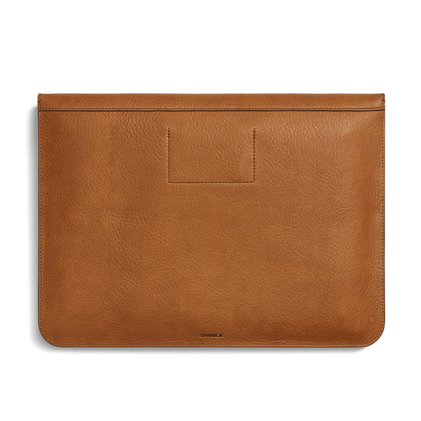 The Shinola Laptop Sleeve - Tan features Natural Grain leather with a smooth finish, minimal stitching, a front leather card pocket, and the Shinola logo printed at the bottom center.