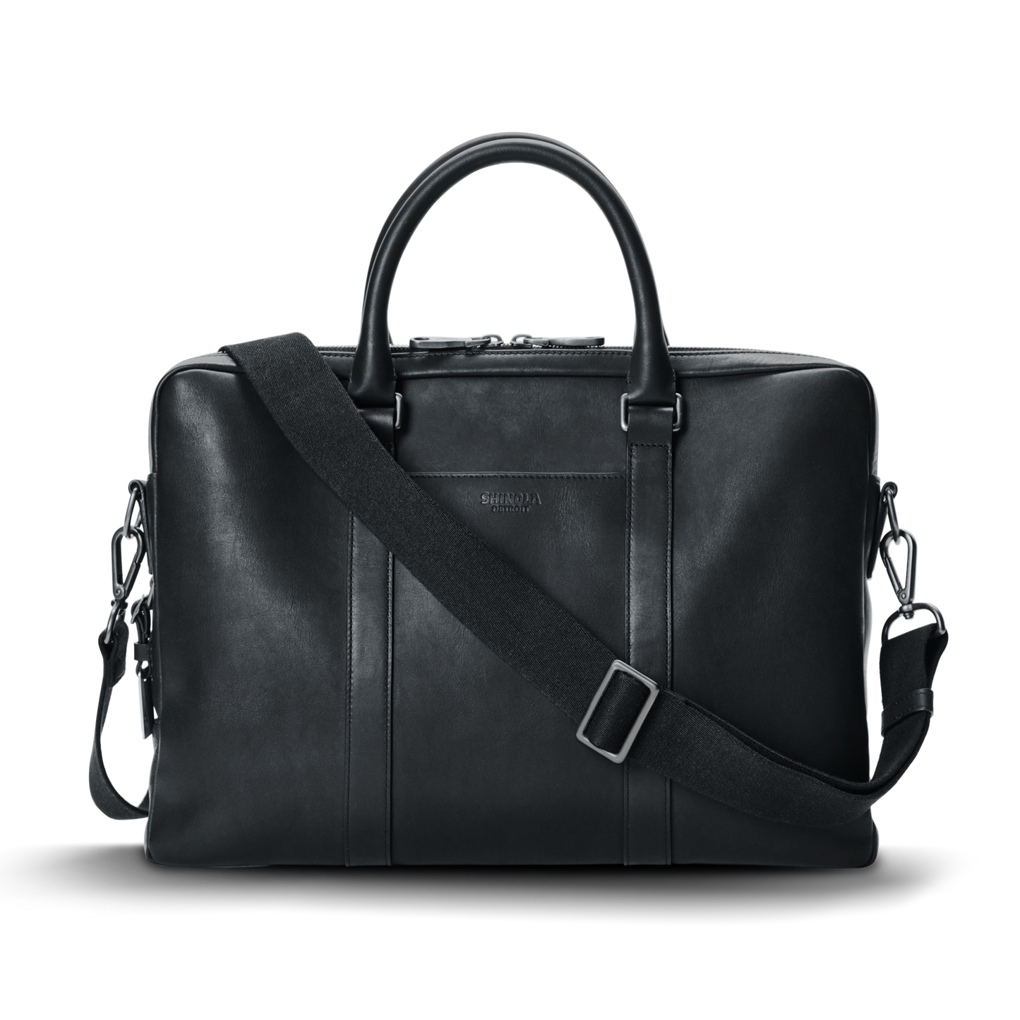 The shinola-jp.computer Briefcase - Black is a sleek leather work bag with double top handles, a detachable shoulder strap, minimal metallic hardware, and subtle front branding, shown against a plain white background.